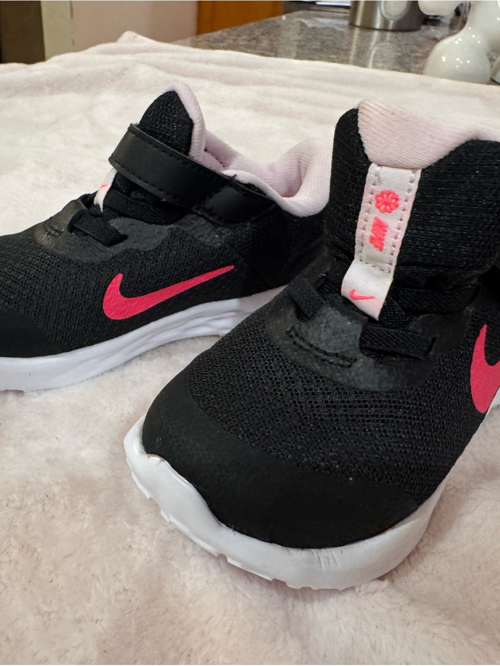 Nike Kids Black Sneakers with Pink Swoosh